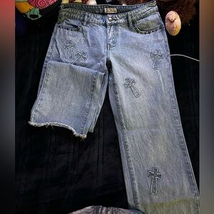 Light blue wash baggy jeans with embroidered cross patches